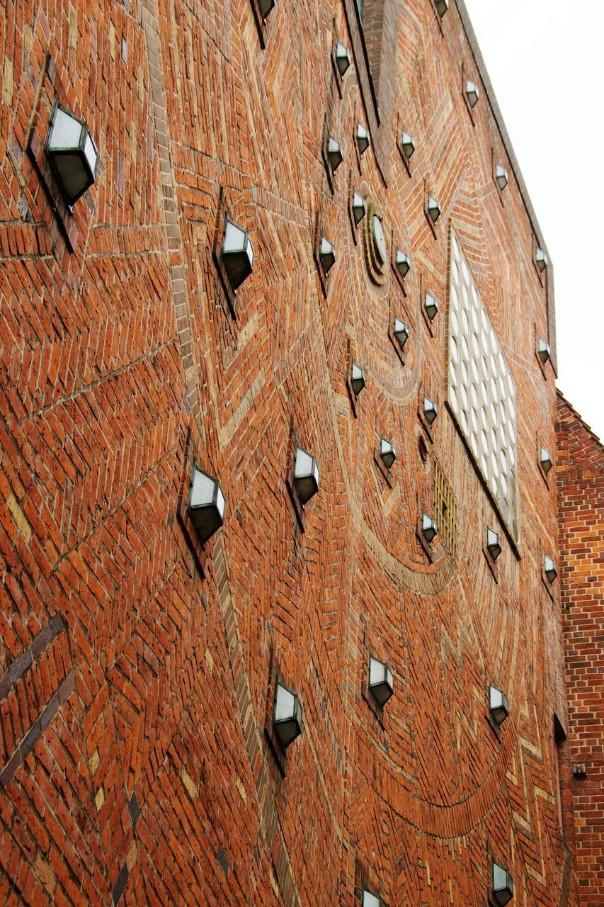 architecture, built structure, full frame, backgrounds, pattern, building exterior, textured, wall - building feature, close-up, brick wall, design, low angle view, red, old, weathered, brown, outdoors, geometric shape, no people, day