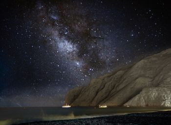 Scenic view of sea against sky at night