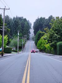 Empty road against sky