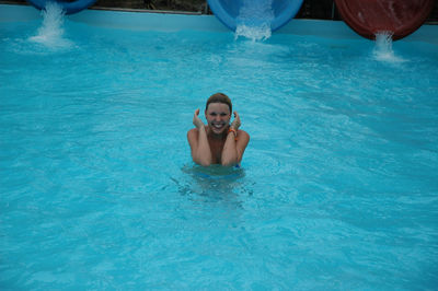 Portrait of woman swimming in pool