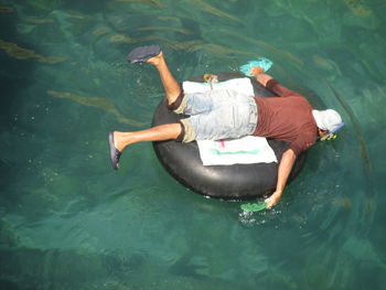 High angle view of man swimming in sea