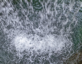 High angle view of water splashing in sea