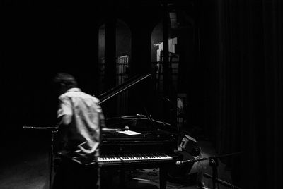 Man playing guitar at music concert