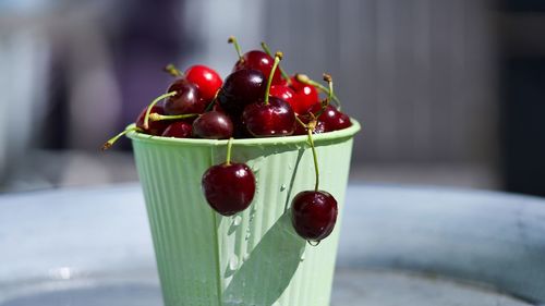 Close-up of cherries on table