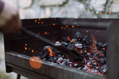 Close-up of charcoal burning in barbecue grill
