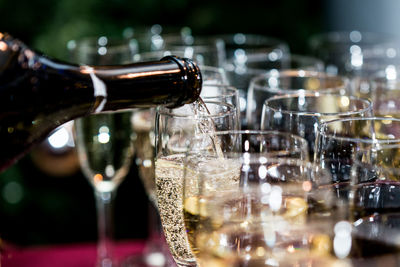 Close-up of wine glass bottle on table