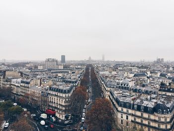 High angle view of city buildings against sky