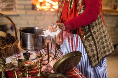 Midsection of woman preparing food