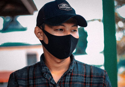 Portrait of young man wearing hat