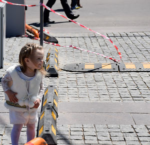 Woman looking at city street
