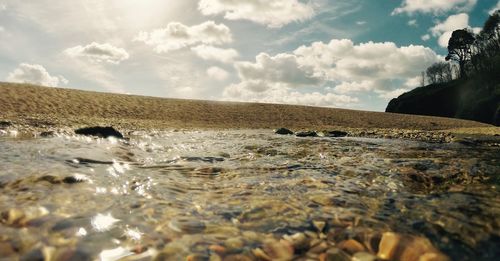 Surface level of sea against sky