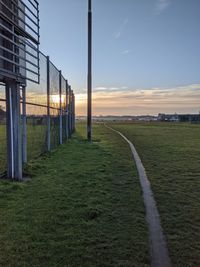 Scenic view of field against sky during sunset