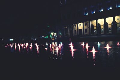 Reflection of illuminated buildings in water at night