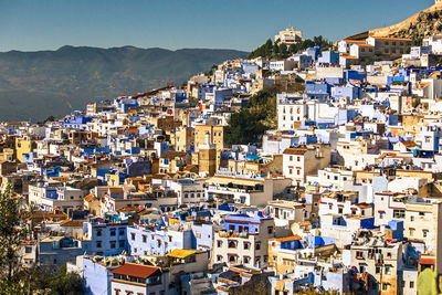 Panoramic wide angle view of iconic blue city, kasbah and medina , chefchaouen, morocco, africa