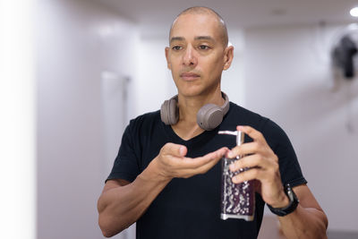 Portrait of young man using mobile phone