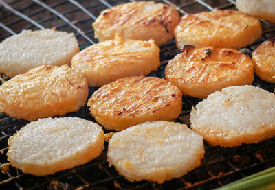 Close-up of breads on barbecue grill