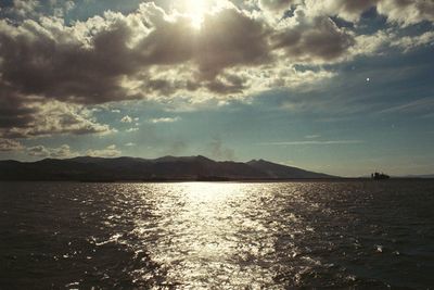 View of seascape against cloudy sky