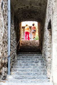 Woman walking up stairs