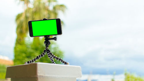 Close-up of telephone pole against sky