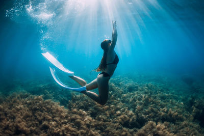 Woman swimming in sea