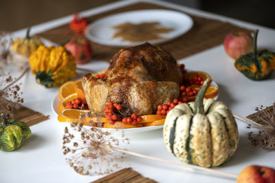 Traditional festive dinner with delicious roasted turkey served on table