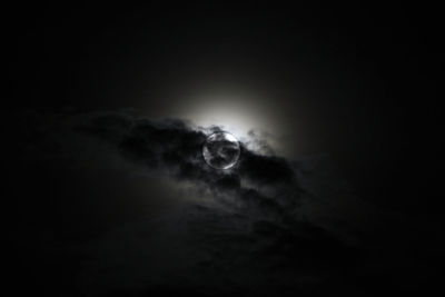 Low angle view of moon in sky at night