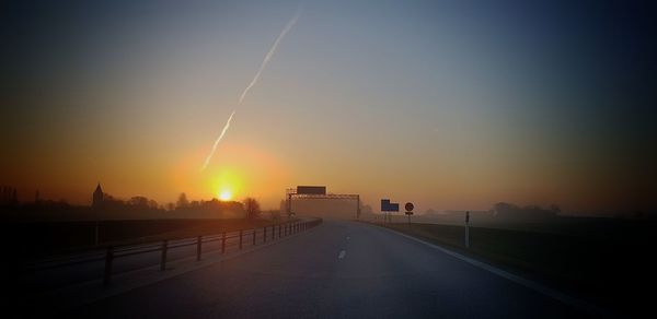 View of road against sky during sunset