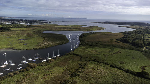 High angle view of land and sea against sky