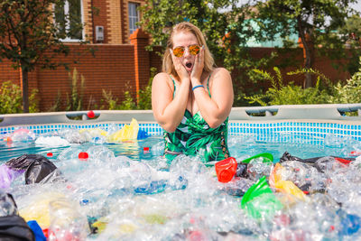 Man wearing sunglasses in swimming pool