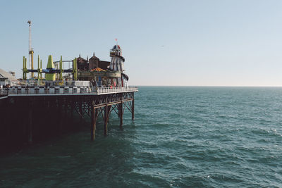 Palace pier on sea against clear sky