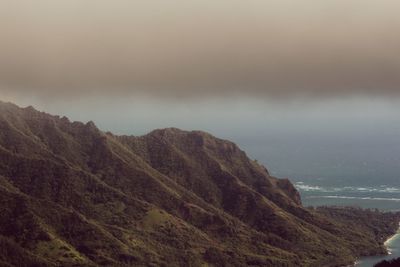 Scenic view of mountains and sea against sky