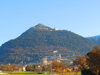 Scenic view of mountains against clear blue sky