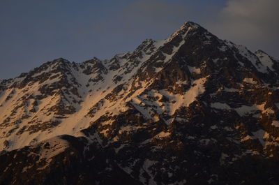 Scenic view of snowcapped mountains against clear sky