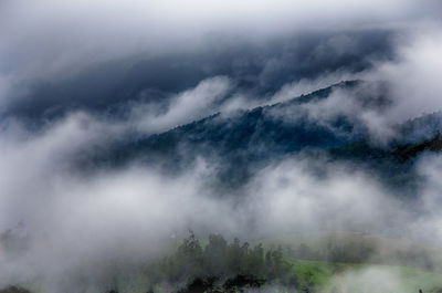 Scenic view of mountains in foggy weather