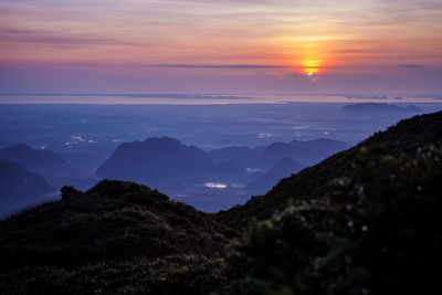 Scenic view of mountains against sky during sunset