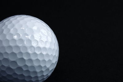 Close-up of ball against black background