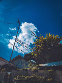 Low angle view of buildings against blue sky