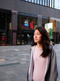 Beautiful woman standing in city