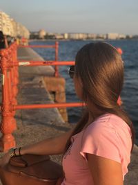 Rear view of woman looking at sea