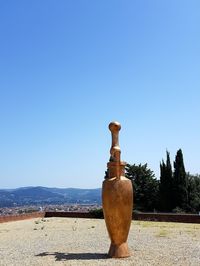 Cross against clear blue sky