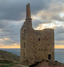 Old ruin building against sky during sunset