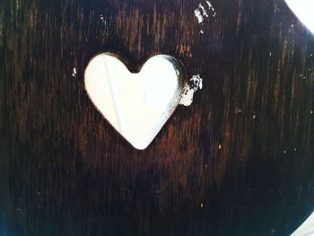 Close-up of heart shape on tree against sky