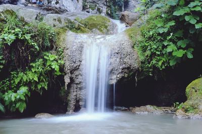 Idyllic view waterfall in forest