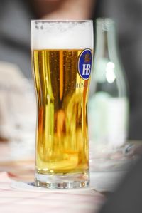 Close-up of beer glass on table