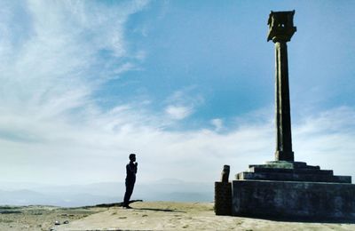 Full length of woman standing against sky