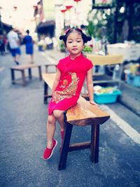 Portrait of girl in multi colored umbrella