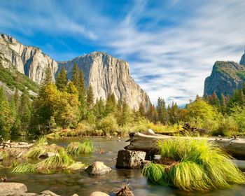 Scenic view of rocks and mountains against sky