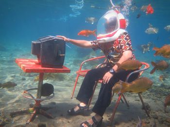 Man watching tv in sea