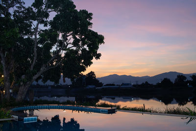 Scenic view of lake against sky during sunset