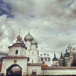 Low angle view of building against cloudy sky